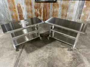 Two Stainless Steel series worktables are on display