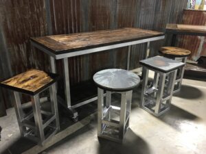 Long worktable with stools for comfort of workers