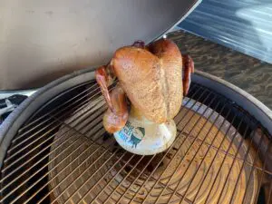 Chicken is being grilled on one of the tables