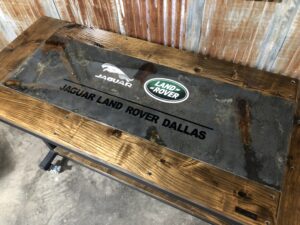 Distressed Metal Inlay Table with Brand Name