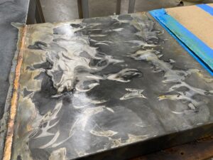 Distressed Metal adds to the finish of these tables