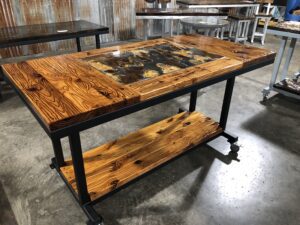A finished Distressed Metal Inlay Worktable