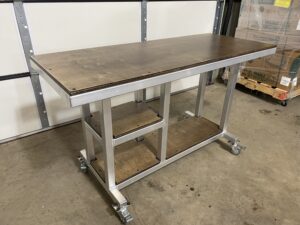 Angled view of worktable with two shelves provided
