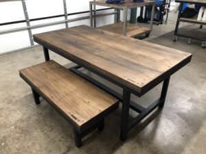 The wood finish of the worktable and bench is excellent