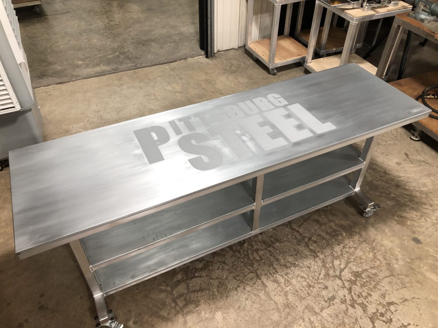 Top View of Table with Pittsburg Steel Logo