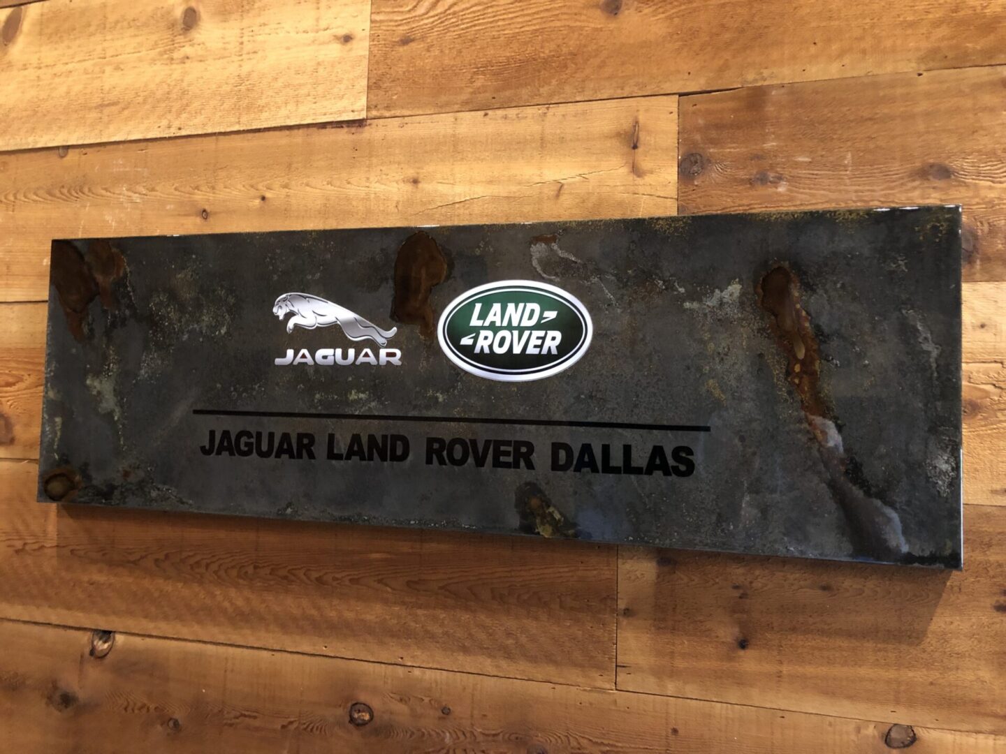 Jaguar Land Rover Dallas Wall Art on display